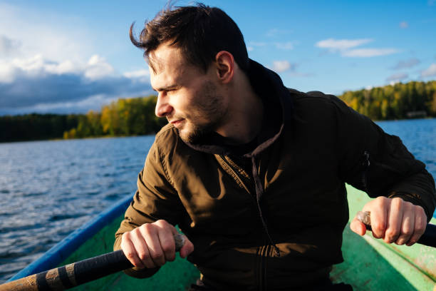 istock A man rowing on oars on an autumn lake 1267513469