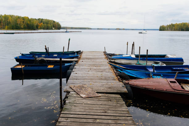 istock Moored boats in the autumn lake 1267514191