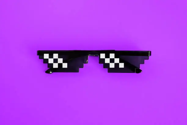 Funny pixelated boss sunglasses on violet background. Gangster, Black thug life meme glasses . Pixel 8bit style.