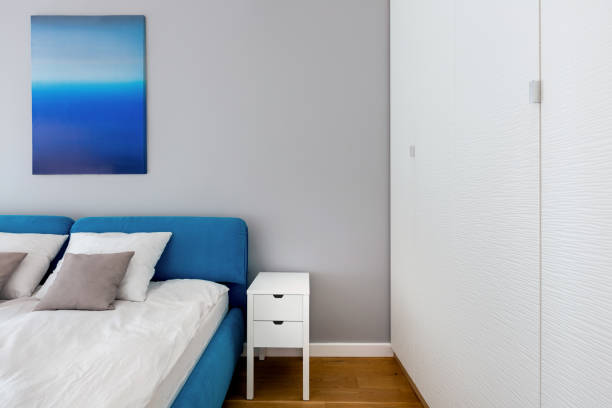 istock Simple bedroom with big white wardrobe 1267515445