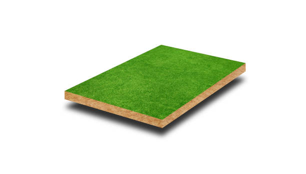 istock Square artificial green grass covered brown soil ground isolated on white background. (Clipping path) 1267517680