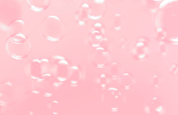 istock Beautiful pink abstract background, Clear soap bubbles float in the air. 1267520505
