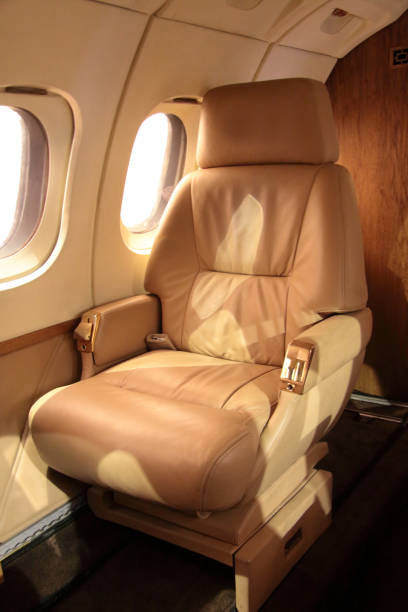 luxury airplane interior - travelling concept luxury airplane interior. business jet chair. luxurious travelling concept private jet interior stock pictures, royalty-free photos & images