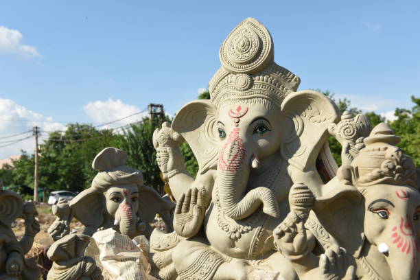 Clay statue of Indian God Ganesha being displayed on the occasion of Ganesh Chaturthi festival Gray colored clay statue of the Hindu elephant God Ganesha being displayed on the occasion of Ganesh Chaturthi festival in India. The festival is also known as Vinayaka Chaturthi, celebrating the arrival of Ganesh to earth from Kailash Parvat with his mother Goddess Parvati/Gauri. The festival is marked with the installation of Ganesh clay idols privately in homes, or publicly as elaborate installations. sabby stock pictures, royalty-free photos & images