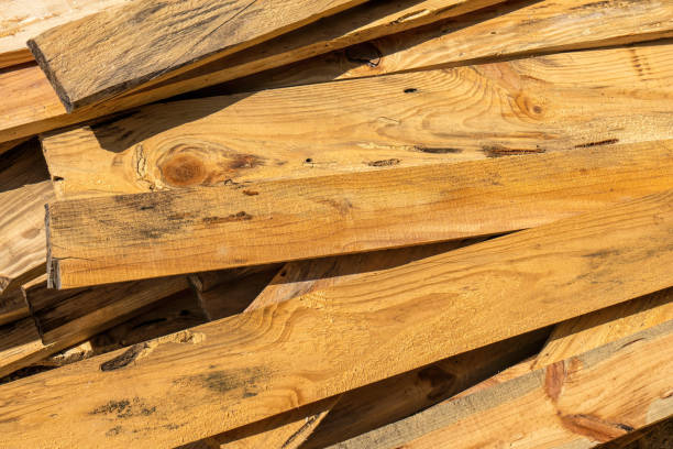 istock Folded pine wooden planks in a sawmill. Piled alder boards as texture 1267524191