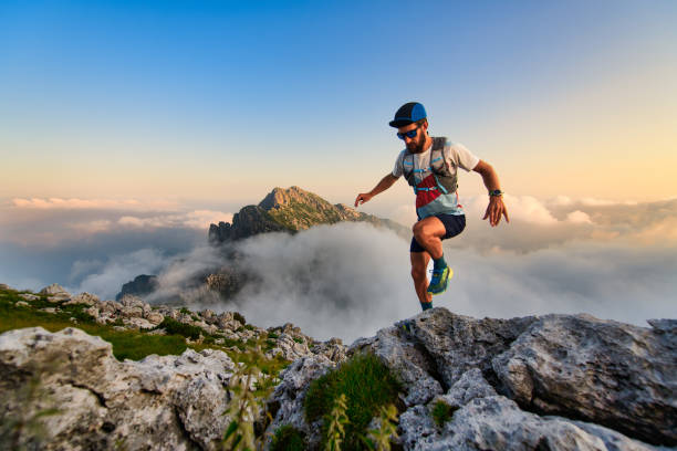 istock Man ultramarathon runner in the mountains he trains at sunset 1267528422