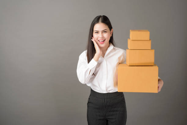 istock Beautiful happiness  woman with box portrait  in studio 1267528477