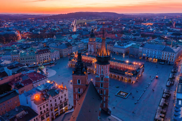 Krakow main square and st Mary basilica Krakow main square and st Mary basilica at dusk aerial drone view krakow stock pictures, royalty-free photos & images