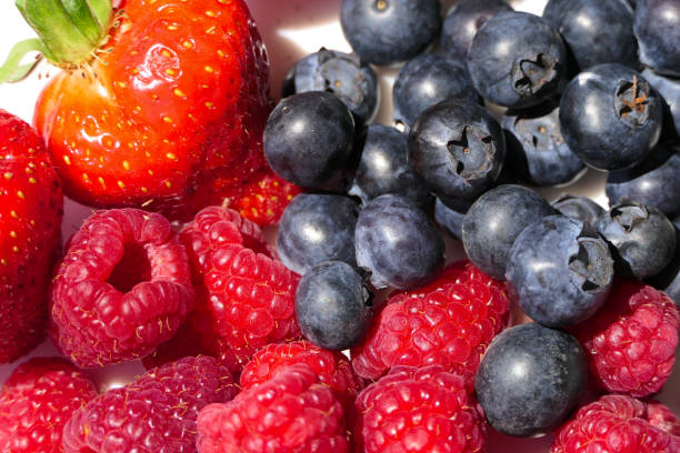 istock Closeup mixed berries with strawberries, blueberries and raspberries from above 1267530868
