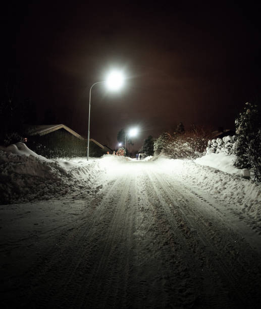 istock Snow-covered Street at Night 1267531255