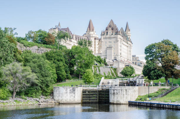 Chateau Laurier Hotel Chateau Laurier Hotel with Ottawa river during summer day.
Canal Rideau Locks are on the right. chateau laurier stock pictures, royalty-free photos & images