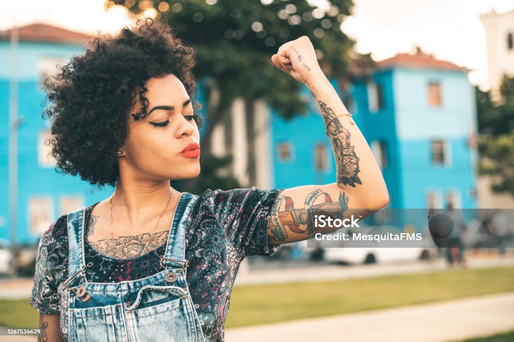 Girl power Punk, Woman, Strong arm, Happy, Tattoo Courage Stock Photo