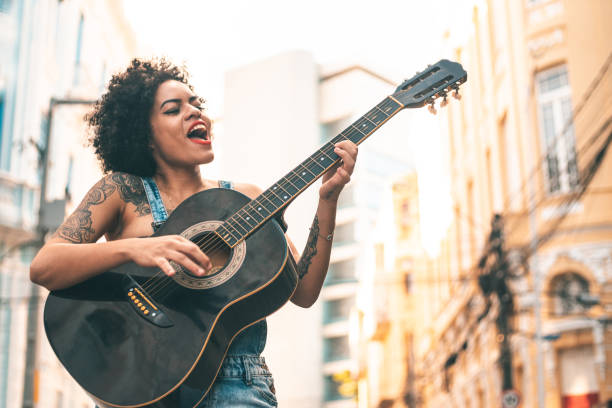 Punk woman acoustic guitar Punk, Music, City Street, Guitar, Artist guitarist stock pictures, royalty-free photos & images