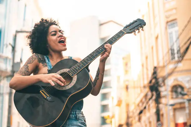 Photo of Punk woman acoustic guitar