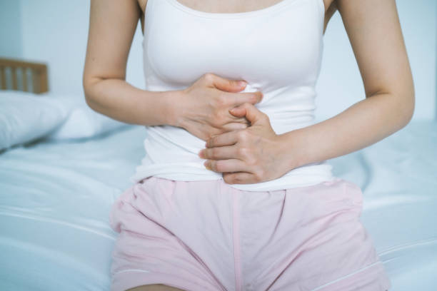istock Woman Touching Abdomen In Pain 1267536830