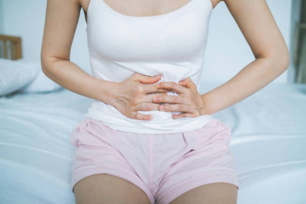 istock Woman Touching Abdomen In Pain 1267536833
