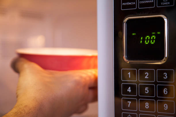 istock Preparing a soup in the microwave 1267542192