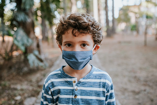 Child with face protection mask