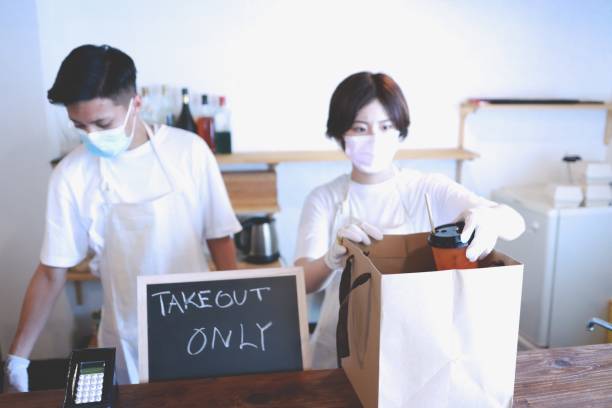 istock Young couple working at cafe in Asia 1267544955