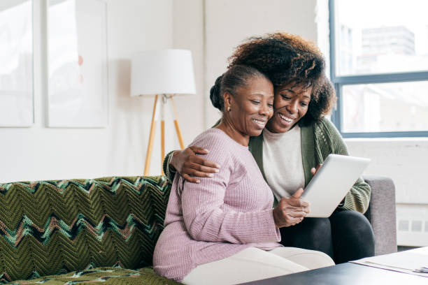 istock Mom and  daughter together online 1267546065