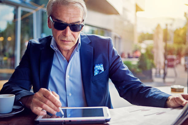 istock Businessman is working with digital tablet in the cafe 1267547577