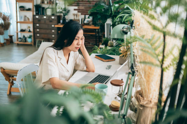 istock asian woman working at home 1267547865