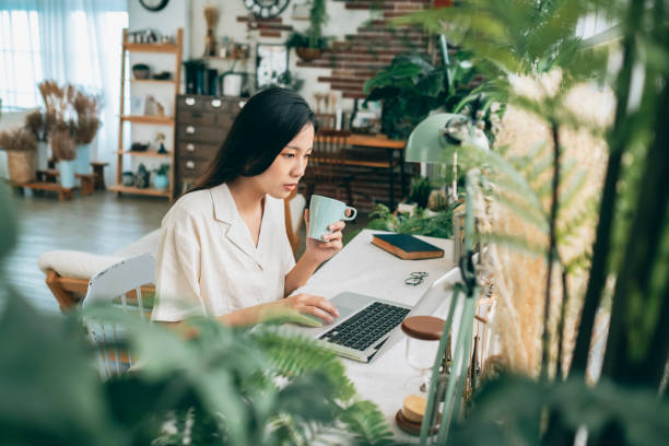 istock asian woman working at home 1267548038