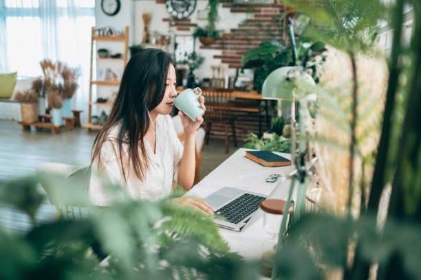 istock asian woman working at home 1267548379