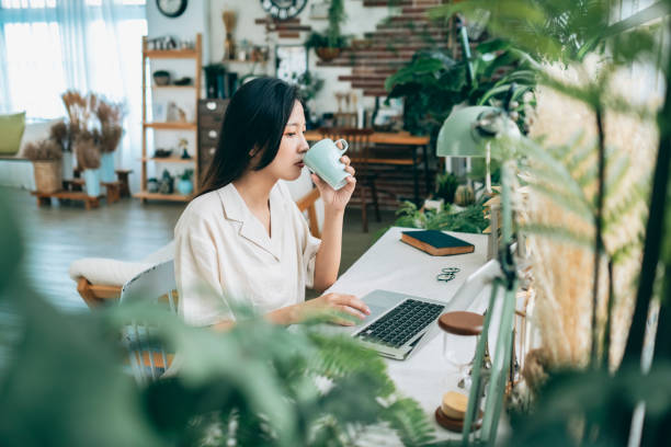 istock asian woman working at home 1267548385