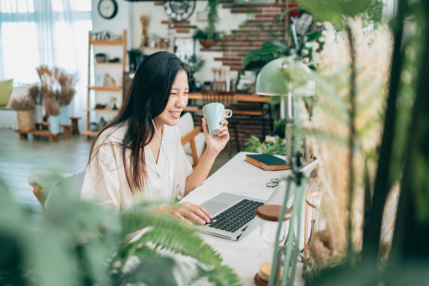 istock asian woman working at home 1267548398