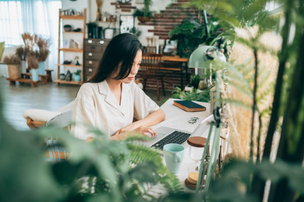 istock asian woman working at home 1267548399