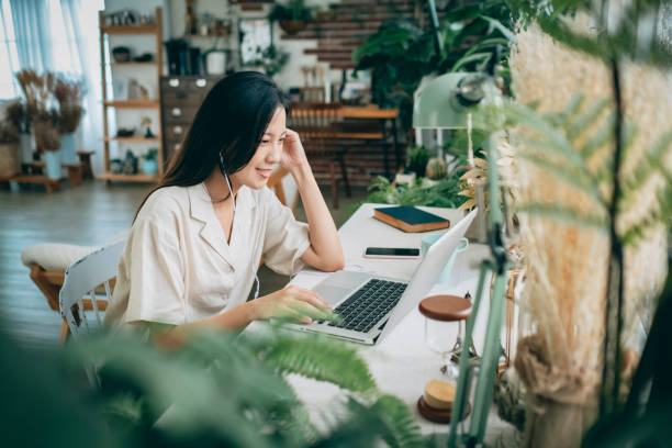 istock asian woman working at home 1267548408