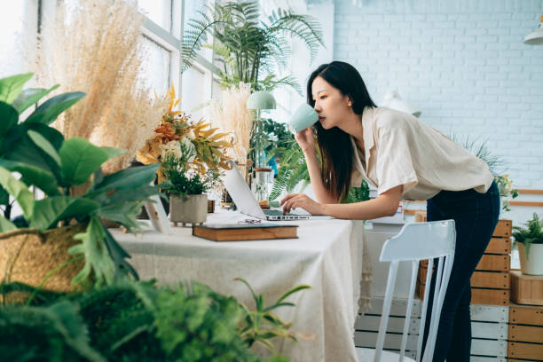 istock asian woman working at home 1267548409