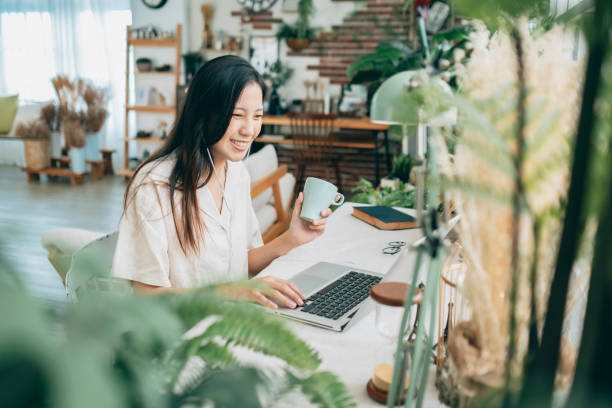 istock asian woman working at home 1267548417