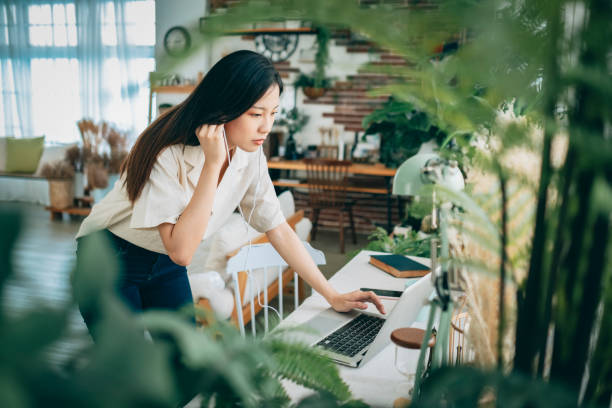 istock asian woman working at home 1267548432