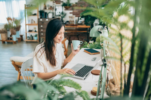 istock asian woman working at home 1267548435