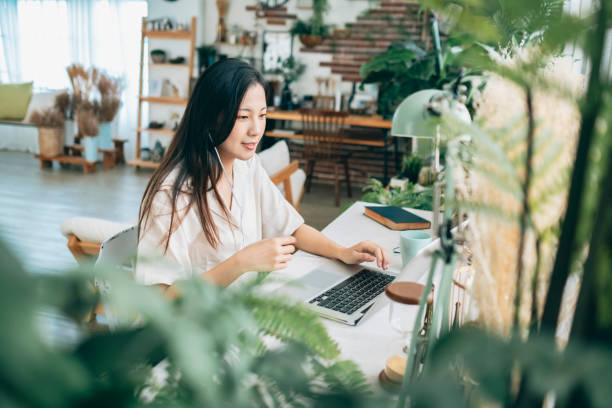 istock asian woman working at home 1267548440