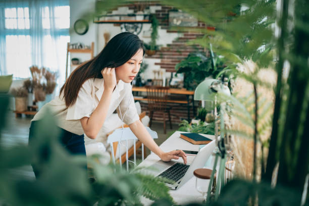 istock asian woman working at home 1267548459