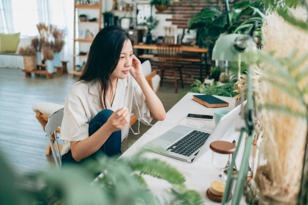 istock asian woman working at home 1267548477