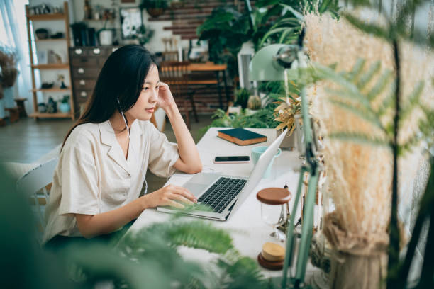 istock asian woman working at home 1267548486
