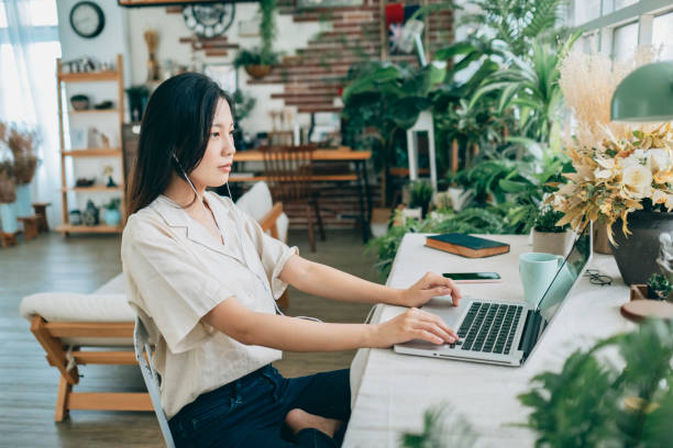 istock asian woman working at home 1267548496