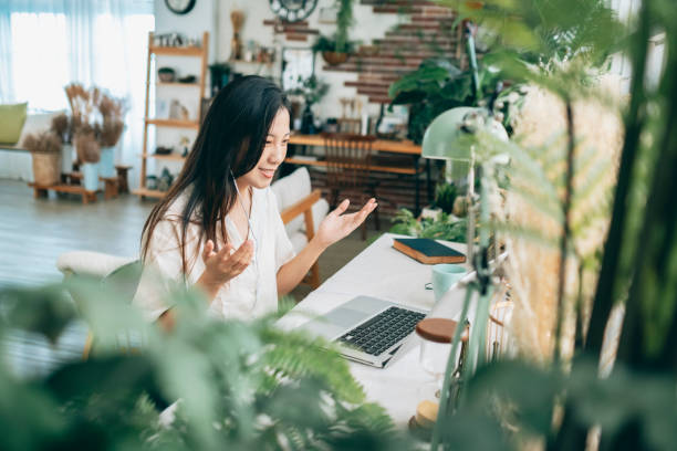 istock asian woman working at home 1267548514
