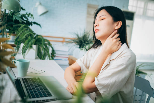 istock Asian woman struggling with using laptop at home 1267548813