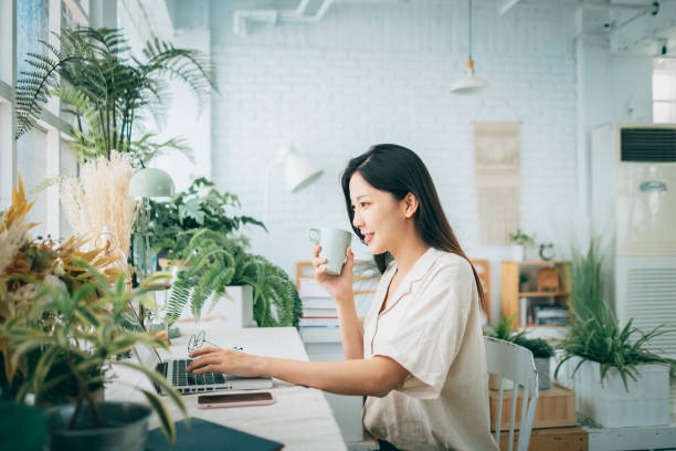 istock asian woman working at home 1267548900