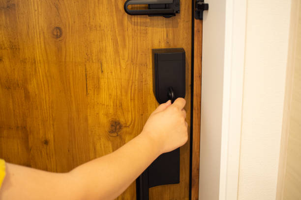 istock A woman locking the door 1267549299
