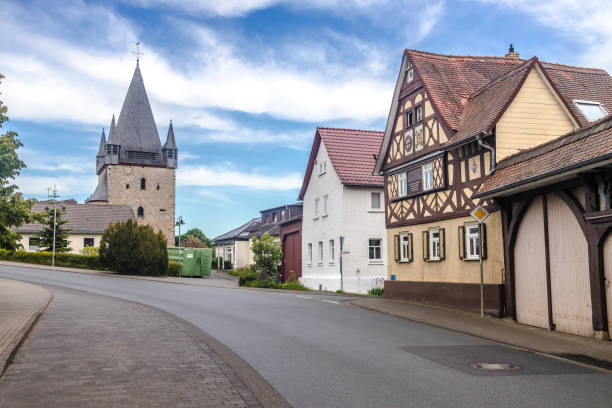 istock Historic Church Tower with half-timbered house 1267551623