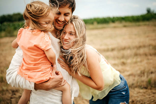 istock Family sharing love in sunset 1267553436