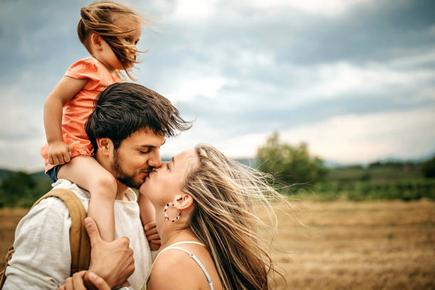 istock Family sharing love in sunset 1267553511
