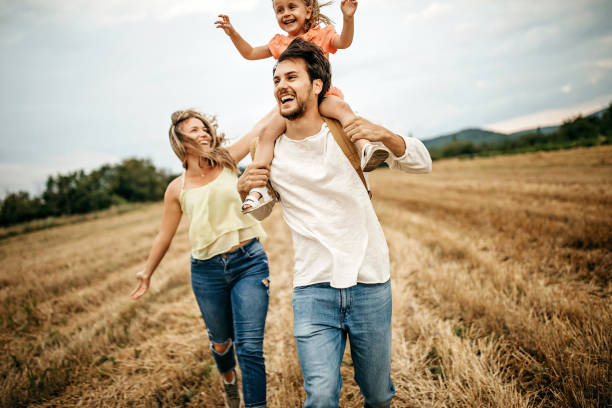 istock Family sharing love in sunset 1267553551