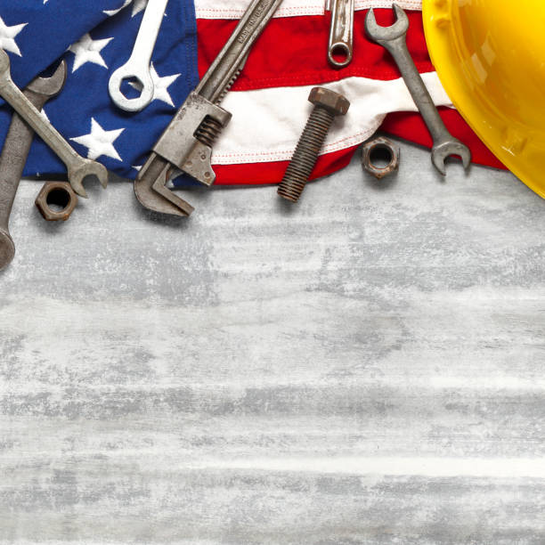 istock Labor day or American labor concept with construction and manufacturing tools on patriotic US, USA, American flag on white wooden background 1267553654